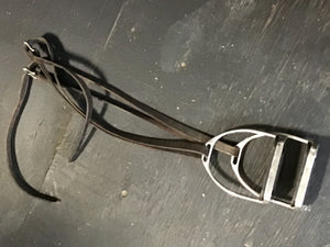 Stirrups with leather stirrup leathers