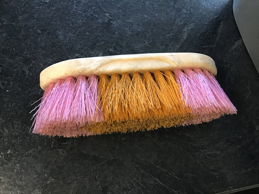 Wooden pink and orange body brush