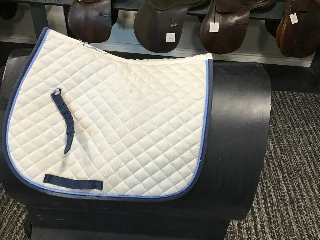 White saddle pad w light/dark blue edging shedrow
