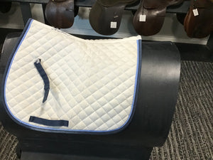 White saddle pad w light/dark blue edging shedrow