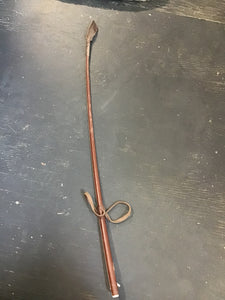 Brown leather whip